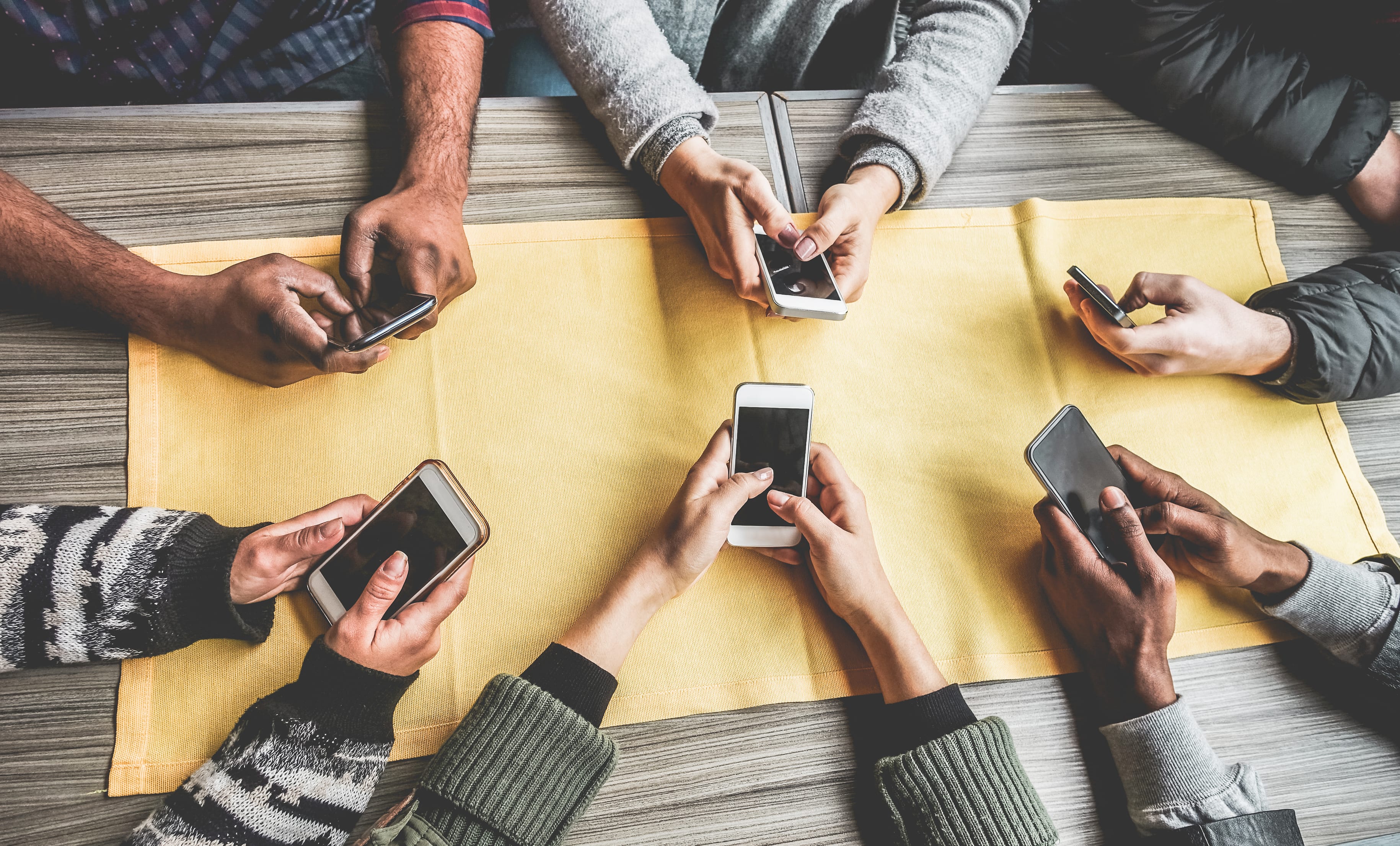 Group of young people using smartphones