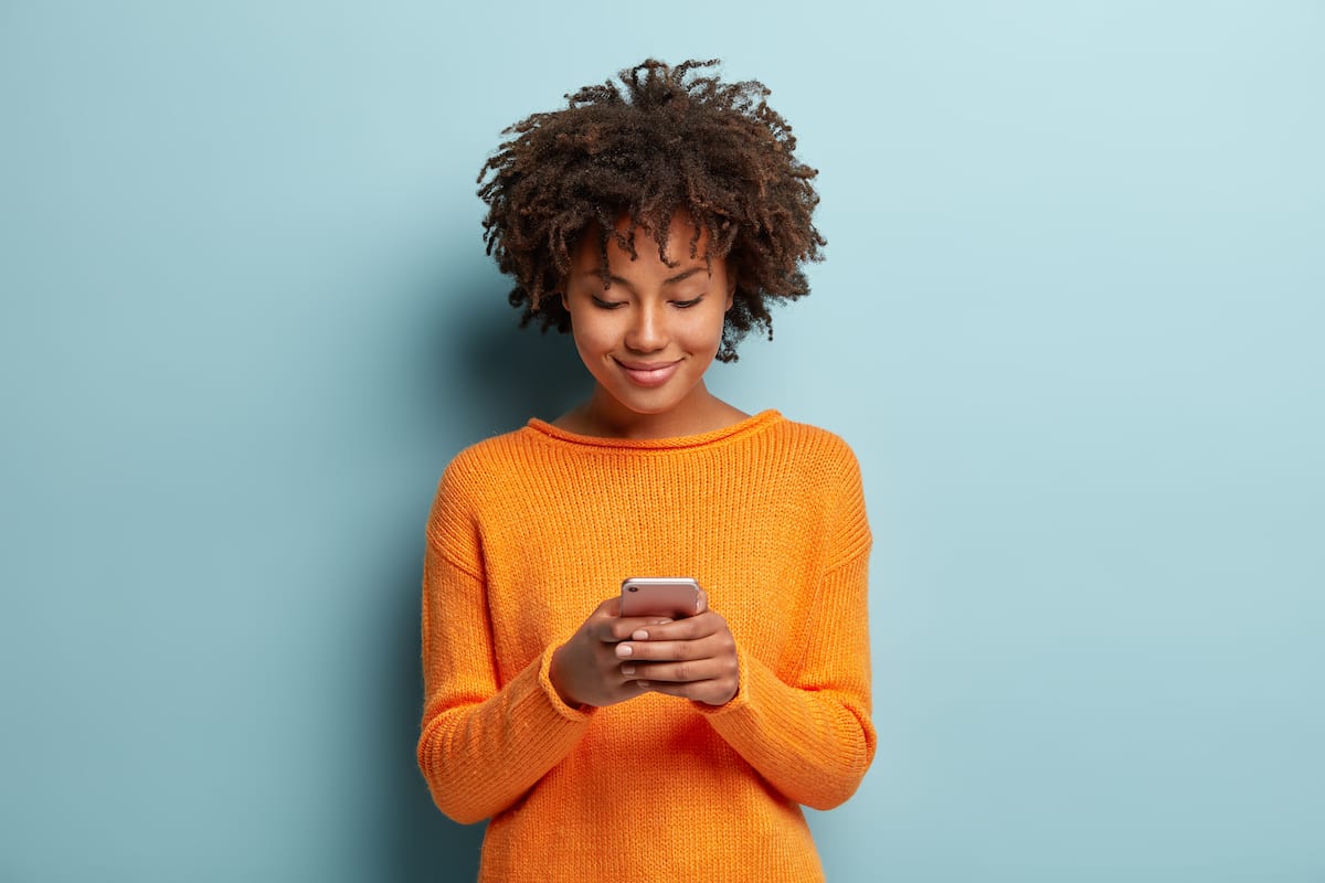 Young woman checking her phone