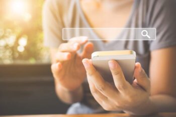 woman searching the internet on phone