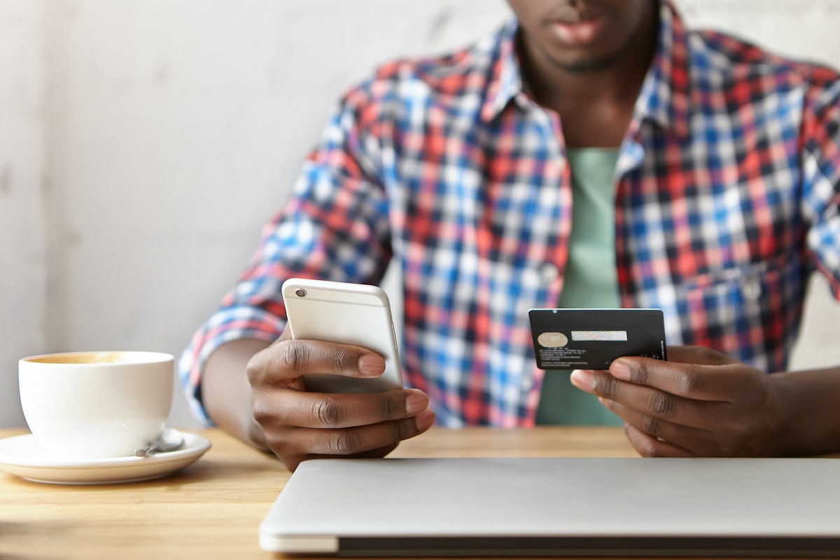 Man making payment online via cell phone