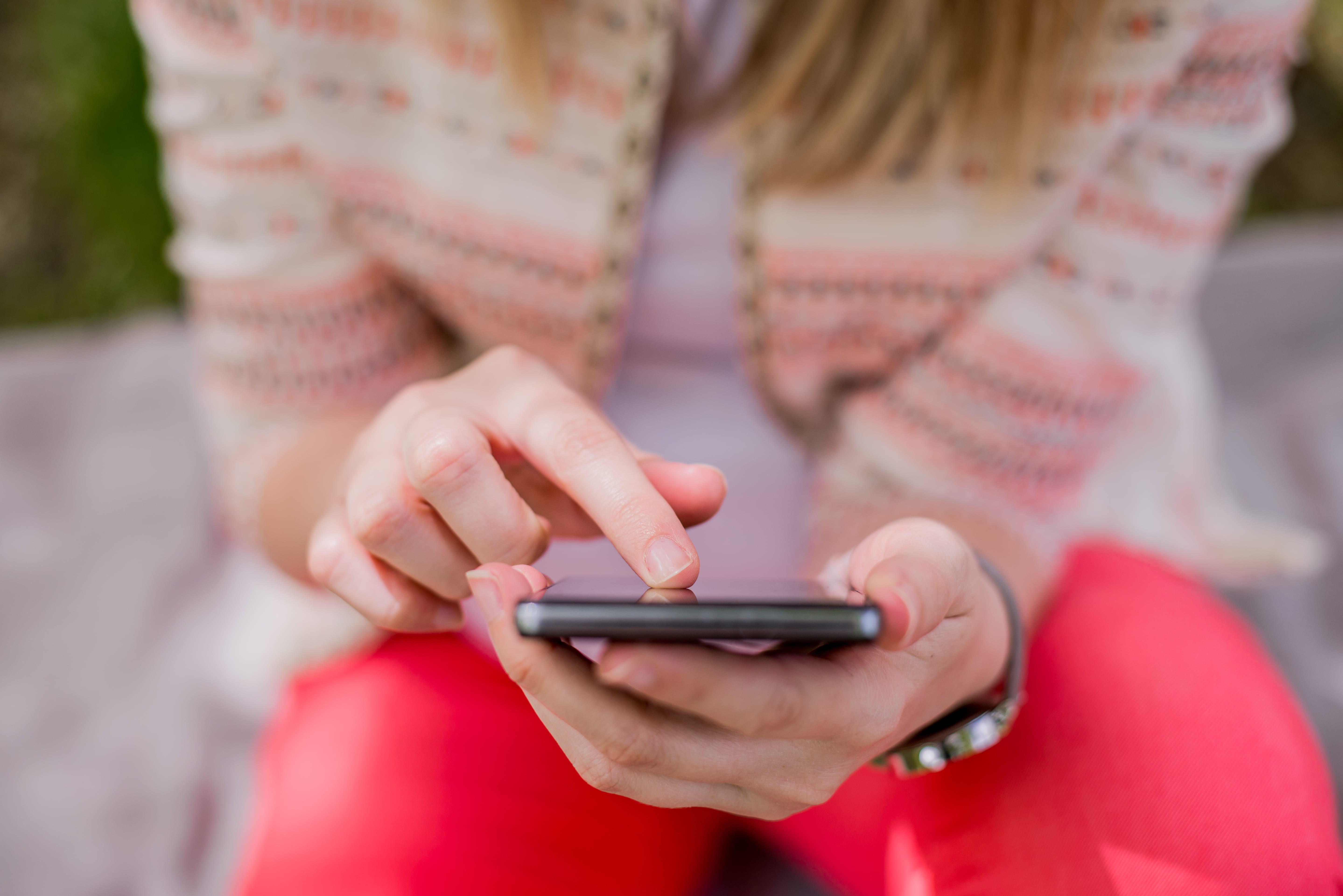 Contact Sanctuary Marketing Group to learn more! Girl on phone