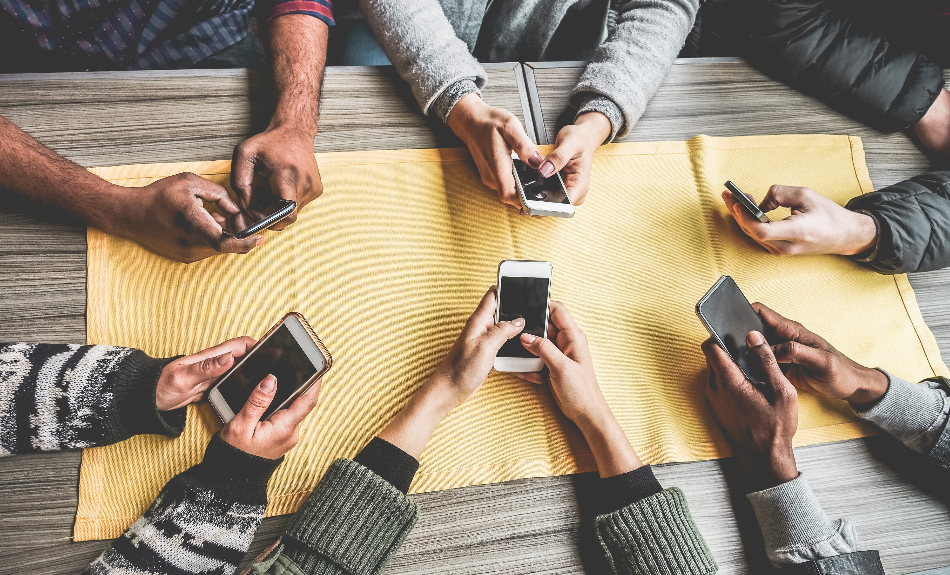 Contact Sanctuary Marketing Group to Learn More Group of young people using smartphones
