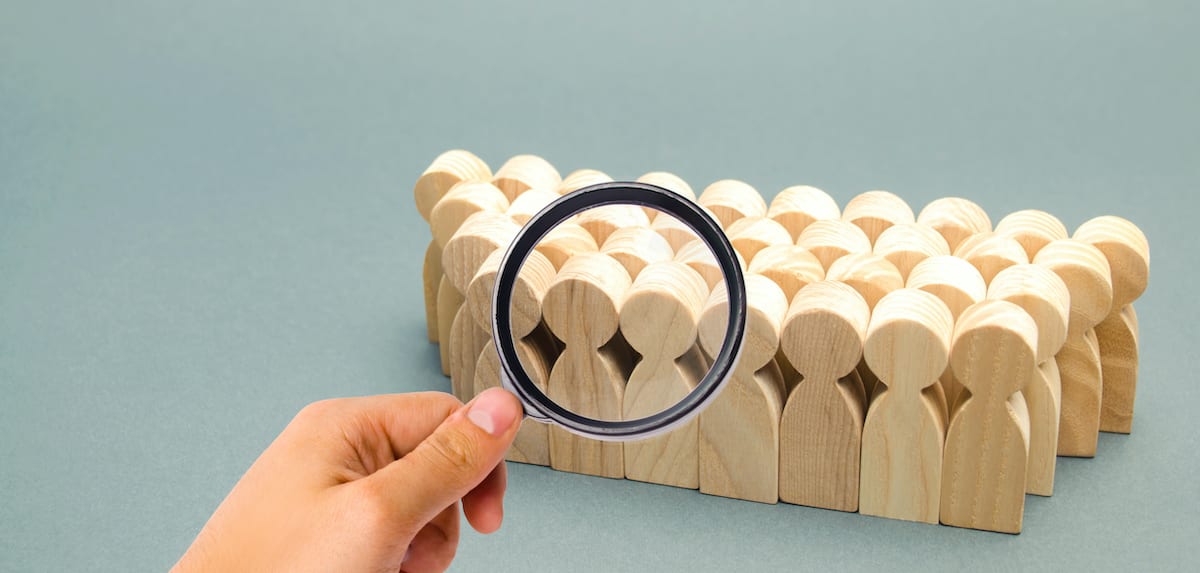Search-Targeting Wooden figures representing audience targeting